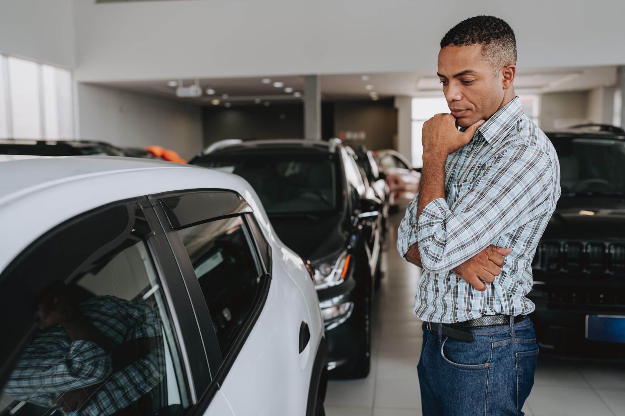 Car shopper considering a newer vehicle and how much it may cost to insure.