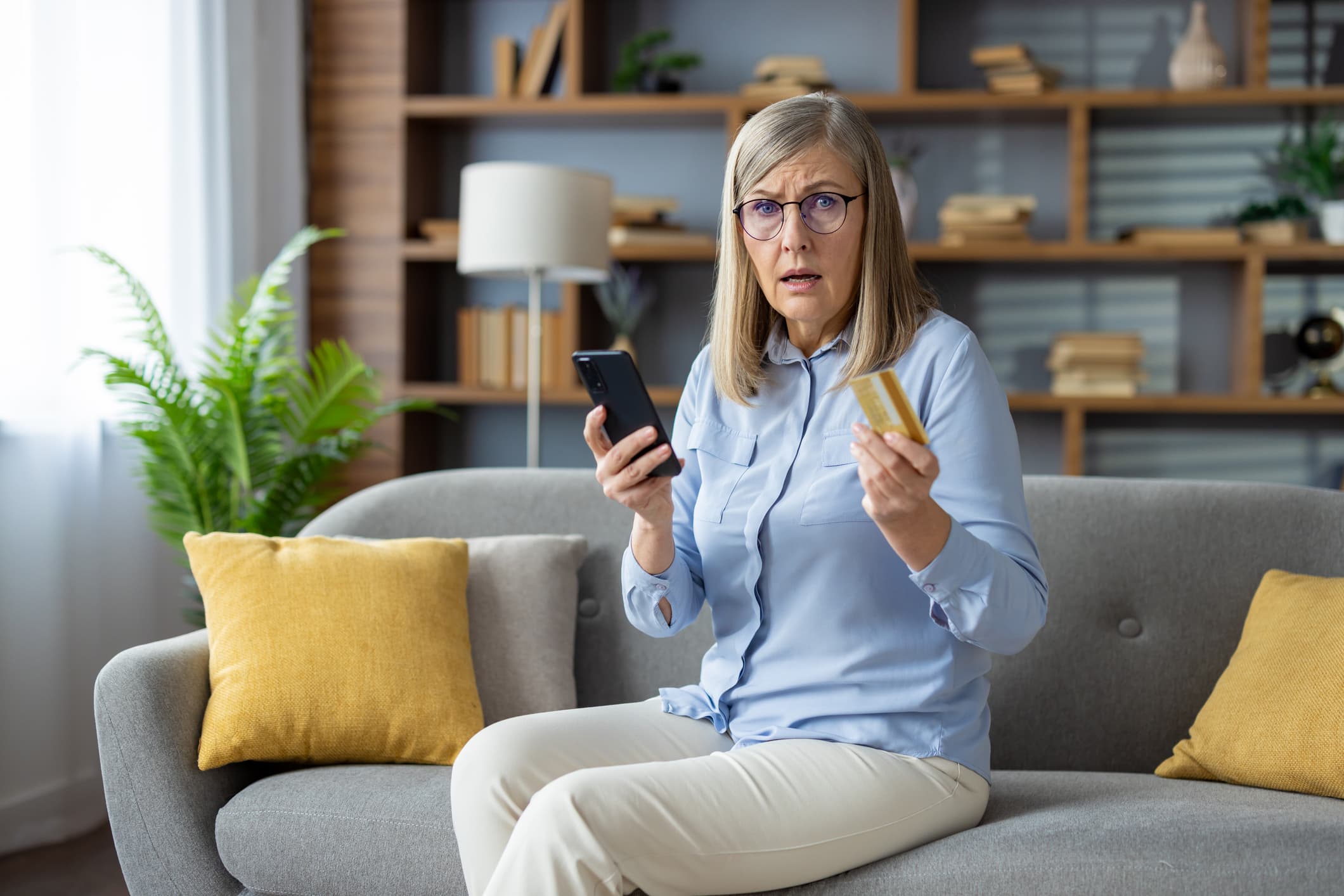 Senior individual using a digital device for identity theft protection