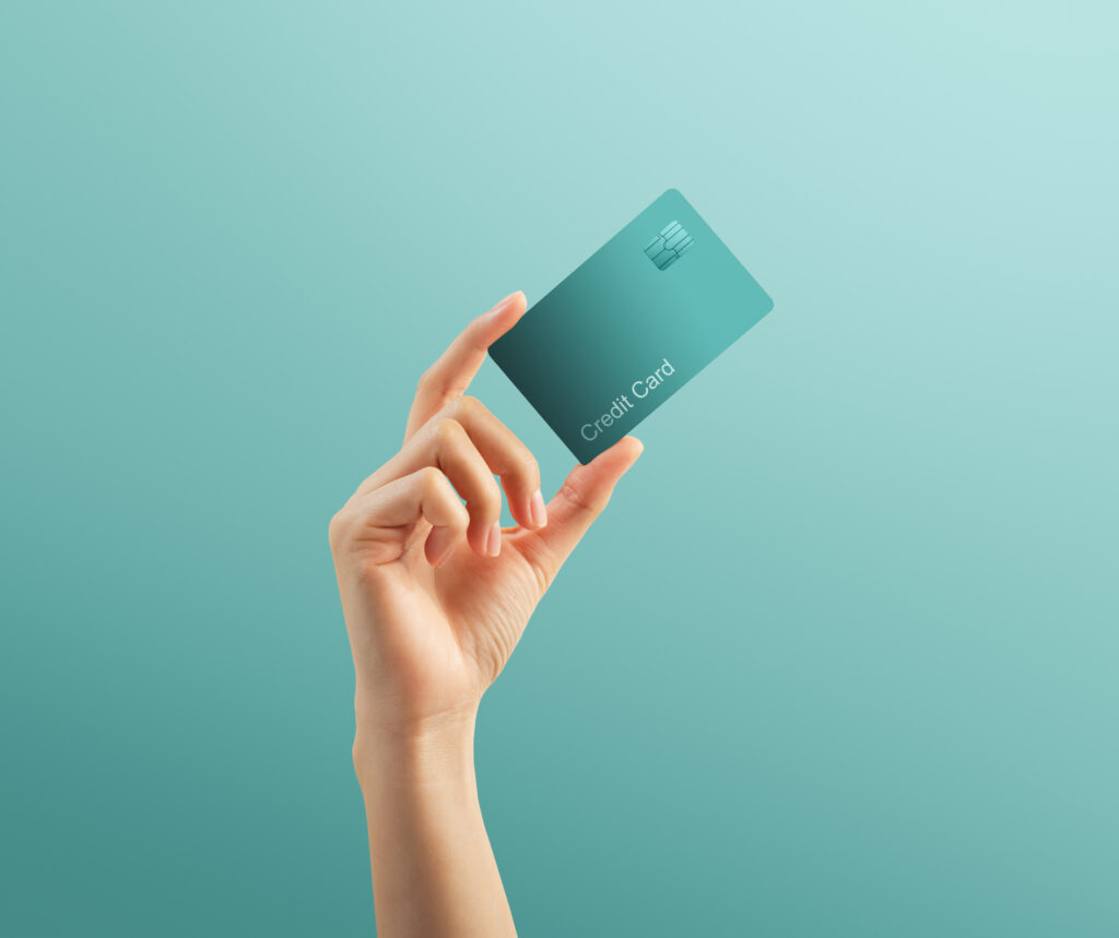 Mission Lane credit card reviews feature image of credit card in a hand
