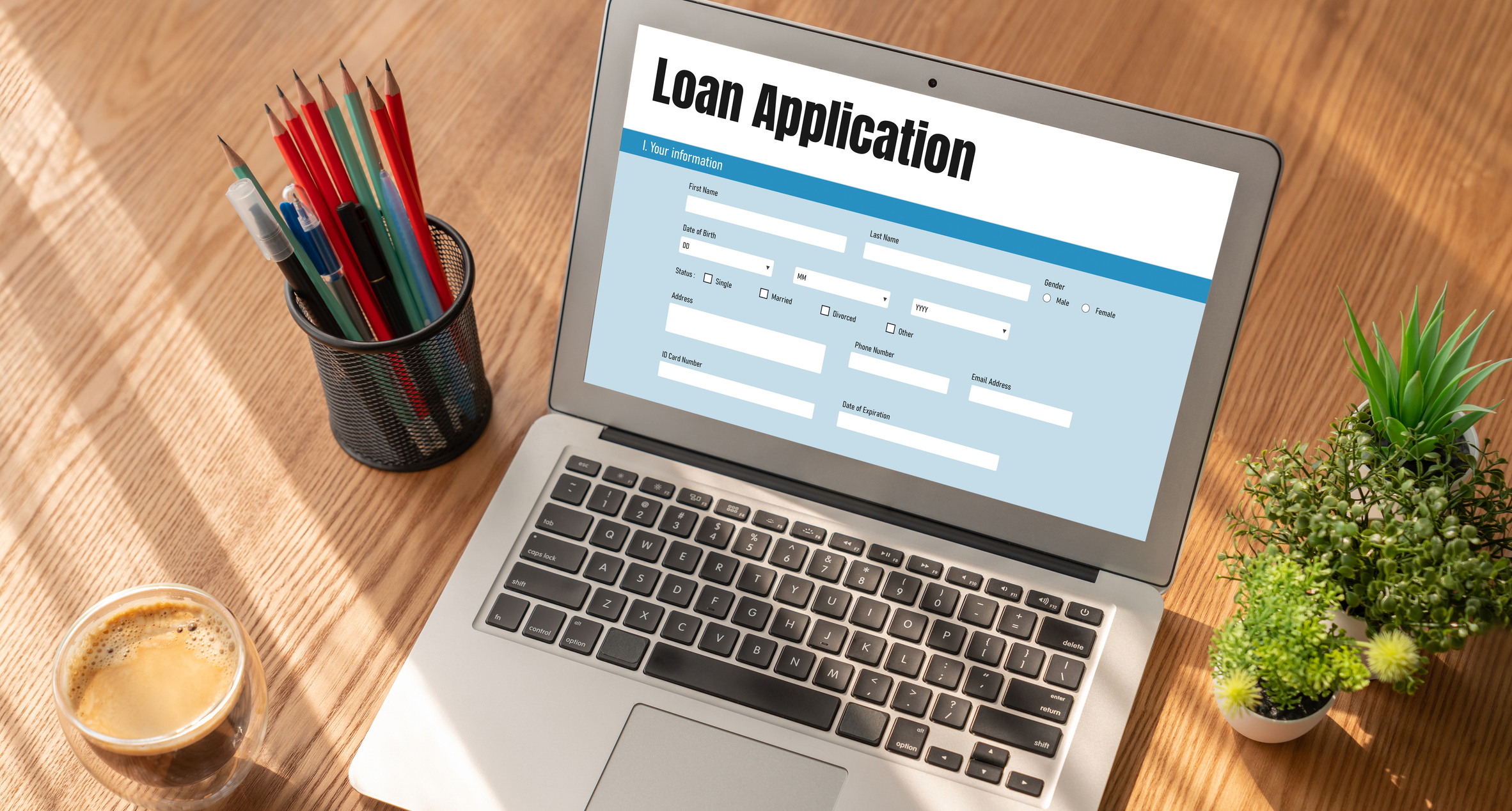 Laptop screen showing a loan application form representing online loan prequalification.
