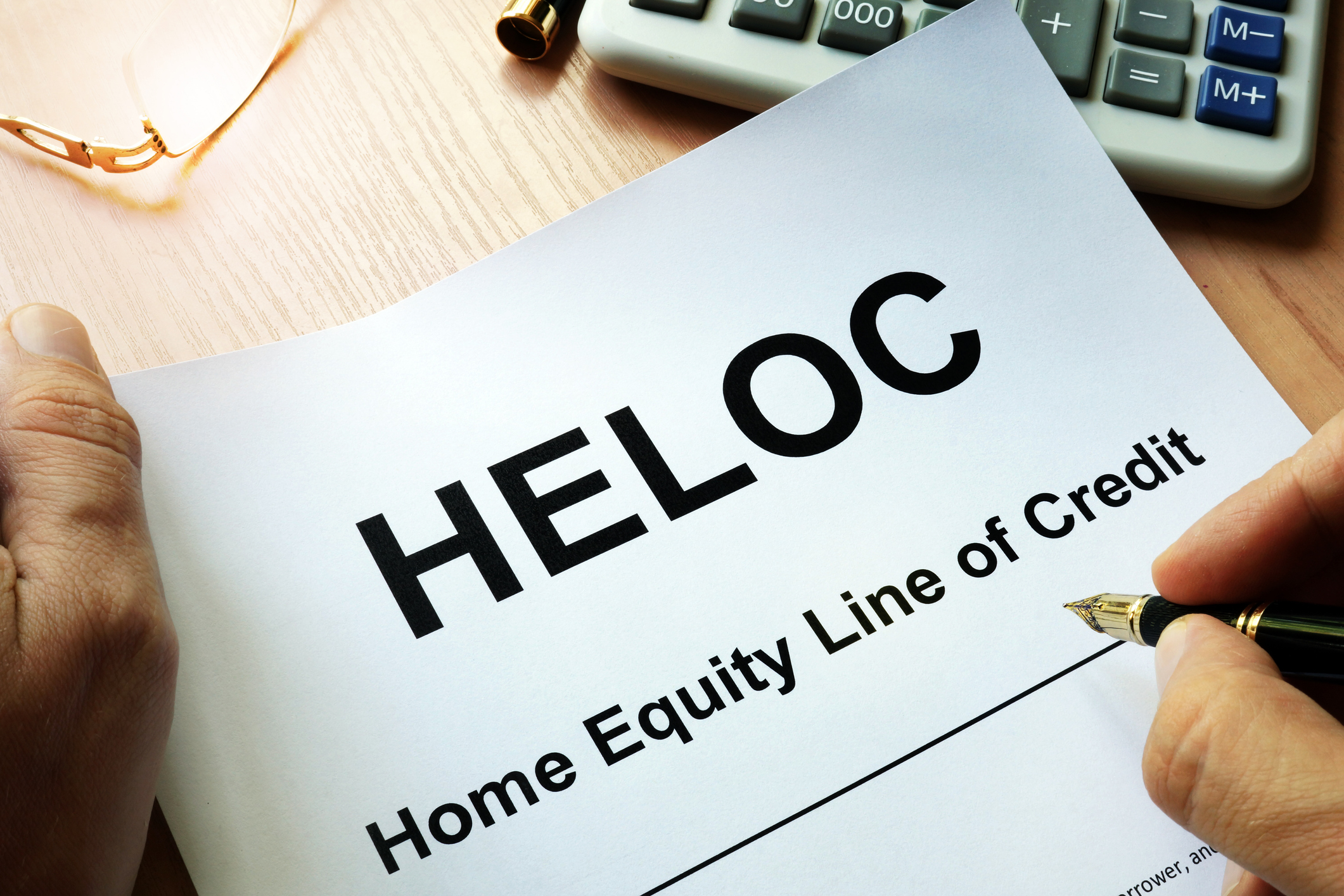 How does a HELOC work? Home equity line of credit document being reviewed on a desk