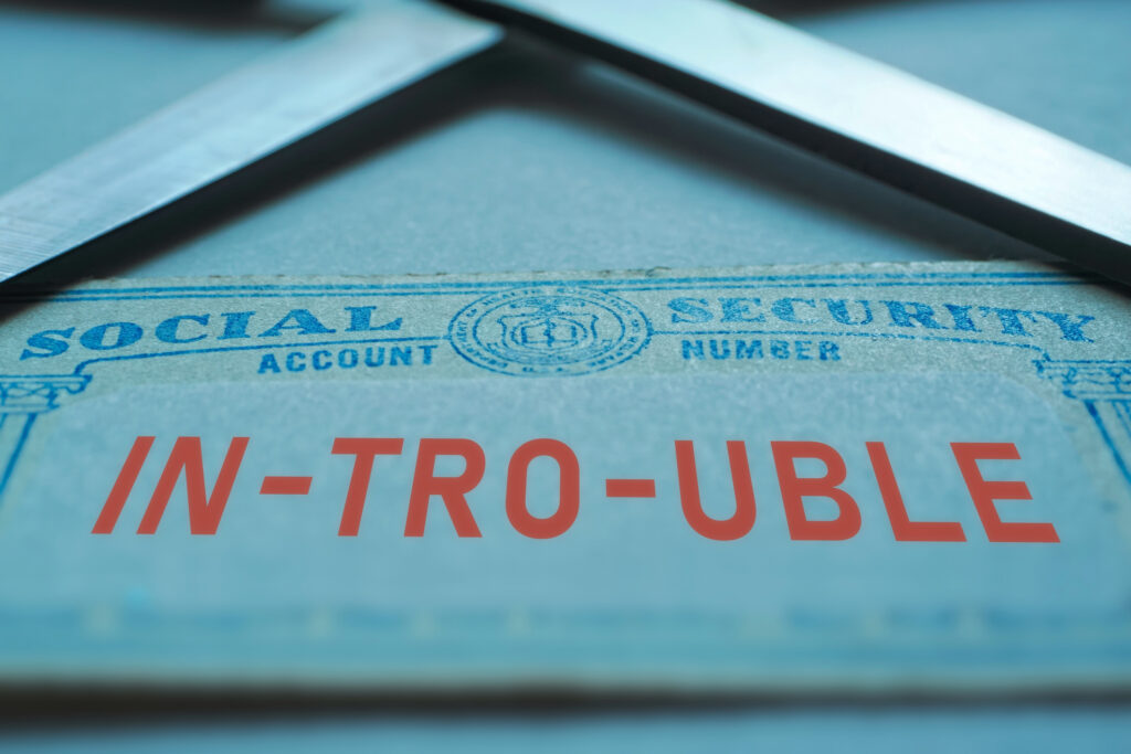 Social Security document labeled in trouble highlighting concerns about Social Security seniors benefit cuts