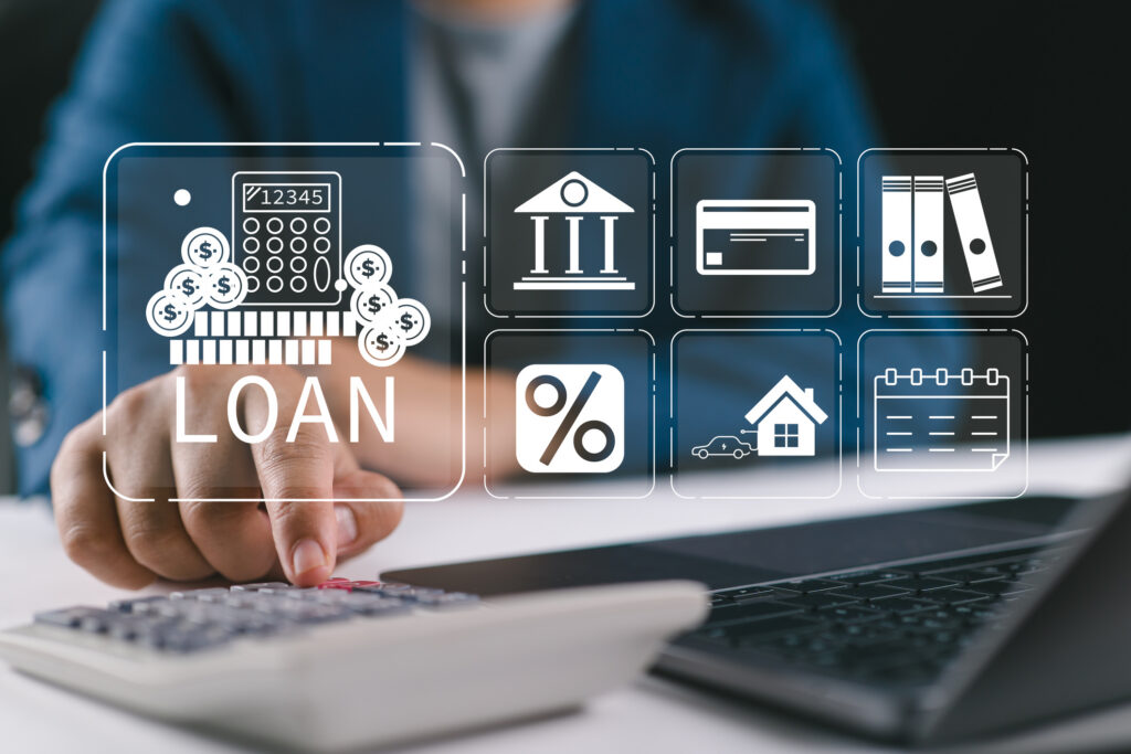 Person using calculator and laptop illustrating acorn finance reviews and loan comparison process